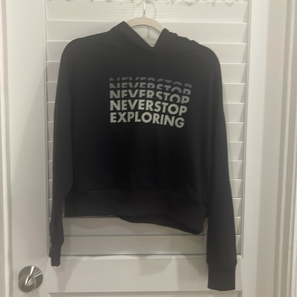 North face black short sweat shirt “never stop exploring “